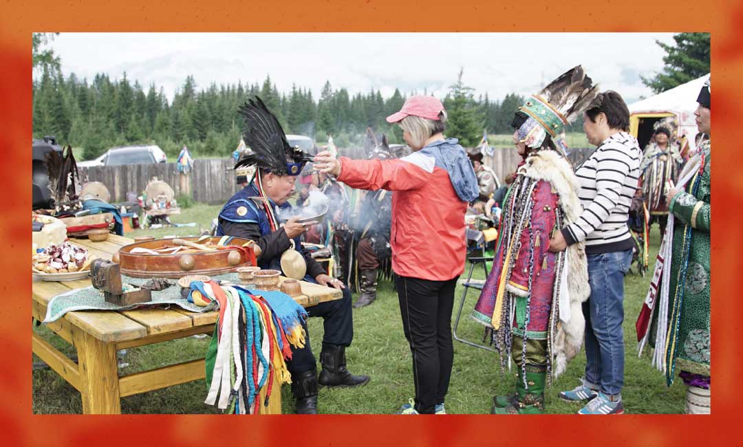 Supreme Shaman of Russia blessing his congregation at Arshan, Siberia.
